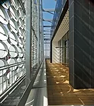 The project earned the Green Building Council of Australia's highest rating at the time it opened, thanks to automated sunshading provided by movable and fixed discs on the main building, as well as p