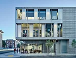 The architects pierced  the poured-in-place-concrete structure with glass window walls so pedestrians standing outside the south facade or the north facade can observe activities within. 