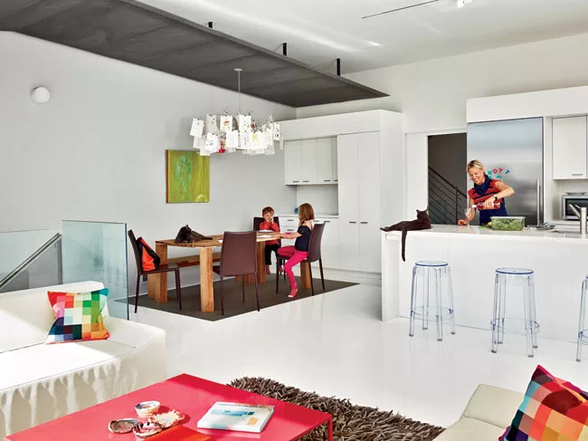 The stair connects the living and dining area with the guest room below and, ultimately, the ground on this sloping site.