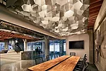 The designers fabricated a light fixture out of nonwoven mesh for the conference room. 