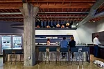 The architects used folded steel plate for the kitchen's island as well as for its light fixture, which they digitally fabricated in hexagons that recall the six-sided nut in Heavybit's logo.