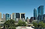 Scogin says he and Elam wanted the building to feel bigger than it is so it would have a presence in the burgeoning city. With that in mind, they used a rugged palette of limestone, stainless steel, a