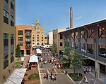 Lake|Flato removed some old buildings to open up views to the historic Brewhouse (center in photo left) and make way for new structures offering spaces for eating, shopping, working, and living. A far