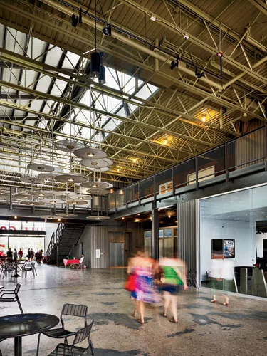 The Full Goods Warehouse, which once stored full bottles of beer, has found new life as a multi-use structure with restaurants, stores, offices, and live/work units. The architects cut skylit breezewa