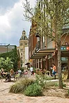 Old freight-rail tracks running through part of the site remind visitors of Pearl's industrial history, even as new uses and landscaping give the place a very different identity.