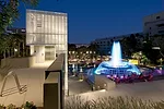 A building for park services also contains a public elevator for ADA-compliant access to the fountain plaza off Grand Street. The architects' hot pink furniture provides the perfect perch from which t