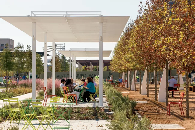 Sheltered seating on the east side looks out to the restaurant pavilion.