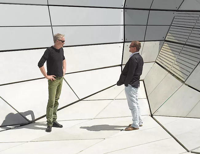 Brendan MacFarland (left) and photographer Roland Halbe outside Les Turbulences. 