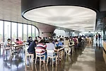 A cafeteria is just one of the shared facilities employees can enjoy, including a gym, a game room, lounges, and outdoor recreation areas for tennis and putting.