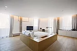 In the bedrooms, the architects designed built-in desks, cabinets, and other furnishings for walls with new white surfaces. Wide-plank oak floors and oak beds complement the sleek built-ins, adding a 
