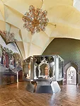 A carousel display in the Kurf'rst-August-Zimmer (Elector August Room) contains a mirror framed in porcelain. Although it doesn't rotate, the vitrine's heptagonal shape in the vaulted backdrop makes i