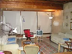 The building interior as it was in the 1960s in a cellularised plan with exposed blockwork and timber clad ceilings.