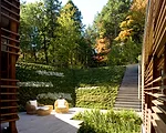 Gluck's work is heavily influenced by his time spent in Japan: the sunken outdoor courtyards envoke the Japanese concept of 'engawa,' an extension of interior spaces outside.