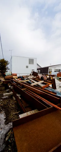 An industrial yard offers undesirable views on the house's south side.