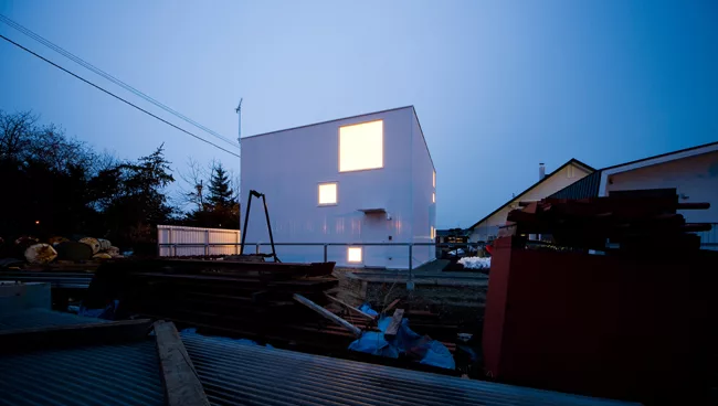 An industrial yard offers undesirable views on the house's south side.