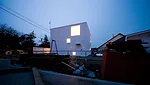 An industrial yard offers undesirable views on the house's south side.