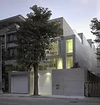 An unassuming street elevation disguises a courtyard within and an entrance to the garage underneath.