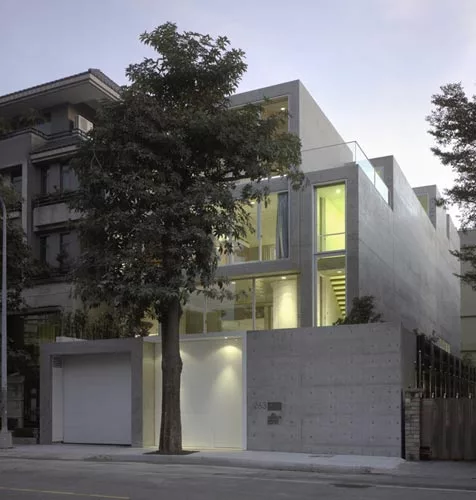 An unassuming street elevation disguises a courtyard within and an entrance to the garage underneath.