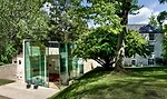 The fascia of the concrete roof is clad with soft gray aluminum to keep the color palette of the structure consistent when observed from the house's upper windows.  The pavilion's corner glass walls f
