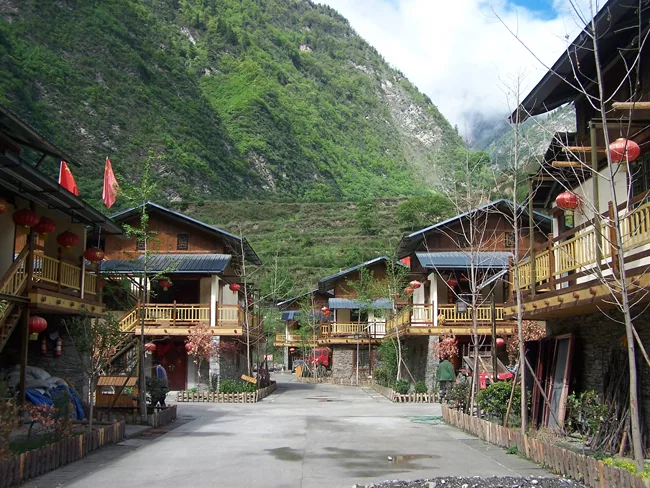 Each dwelling houses an average of six people. External staircases connect porches and free up interior space.