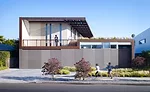 The Yin-Yang House, named by the clients, unifies indoor and outdoor spaces into a whole. It appears solid from its street-facing facade, clad in cement board, but gives way to courtyards.  