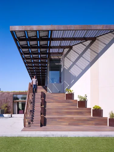 Bedrooms on the second floor open out onto a porch with direct access to the backyard and bamboo bleacher stairs.