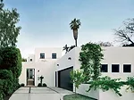 Architect James Gauer designed an elegant procession by separating the house from the street with a garage and garden.