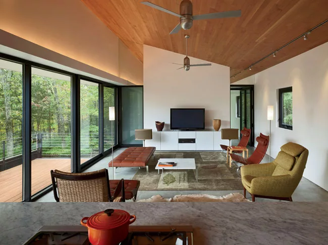 Polished concrete floors contain a radiant-heating system in the south-facing living room.