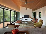 Polished concrete floors contain a radiant-heating system in the south-facing living room.