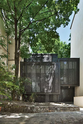 Perforated metal screens offer privacy and daylight.