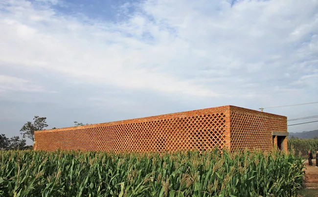 The architect was inspired to design the brick screen after a visit to the westernmost areas of China, including Kashgar in Xinjiang province. The screen helps keep the house cool in summer and warm i