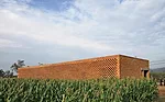 The architect was inspired to design the brick screen after a visit to the westernmost areas of China, including Kashgar in Xinjiang province. The screen helps keep the house cool in summer and warm i