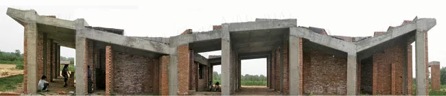 An angled concrete roof collects and stores rainwater and provides a place to dry food.