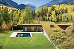 From the main house, the owners see mostly planted roofs and the white oak rain-screen for the bedrooms