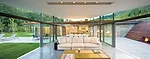 A terrazzo floor of quartz chips and black mortar unites living and dining areas with the terraces outside.