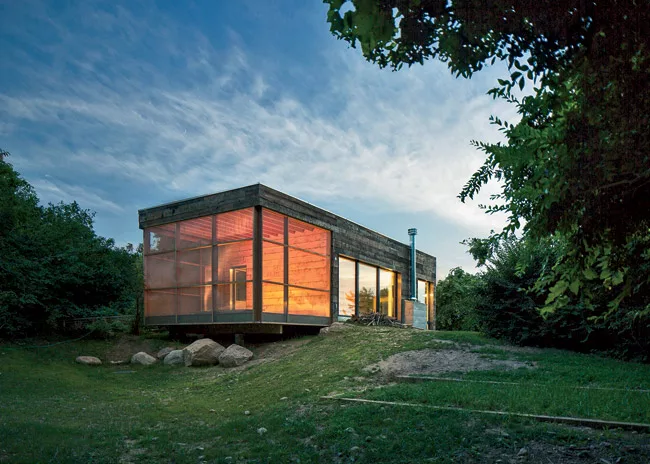 The screened porch faces Long Island Sound to the north. 
