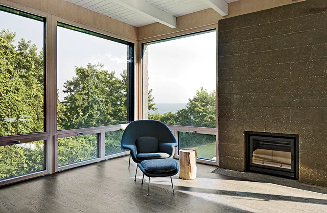 North-facing living and dining areas and a screened porch frame views of the water.