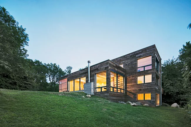 North-facing living and dining areas and a screened porch frame views of the water.