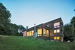 North-facing living and dining areas and a screened porch frame views of the water.
