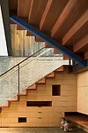 Skiers enter the house on the west and descend stairs fitted with metal treads to the boot room.