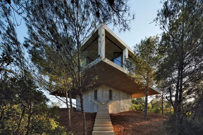 A bifurcated staircase marks the entrance.