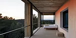 Living areas become verandas when the glass walls slide open.