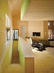 For panache, the architect stained the interior fir cladding in acidic hues of green, orange, and yellow.