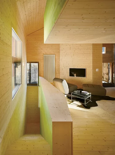 For panache, the architect stained the interior fir cladding in acidic hues of green, orange, and yellow.