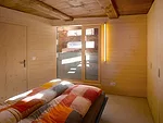 The lower level contains the bathroom, the master bedroom, and storage. The architect brought in light with existing openings, but also added strategic cuts where appropriate.