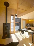 Upstairs, the former hayloft was transformed into living, dining, and kitchen spaces.