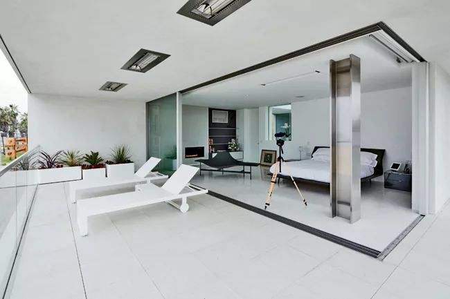 The master bedroom has ocean views, enhanced by window-walls.