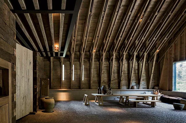 The main entrance, at one end of the gabled structure, opens onto a reception hall.