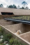 The stables feature outdoor stalls of brick covered in earth and concrete.