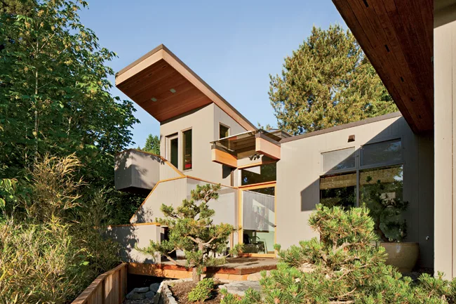 Anthony Belluschi added a second-story loft space to the house his father, Pietro, built in 1948. Original glass expanses offer views of downtown.